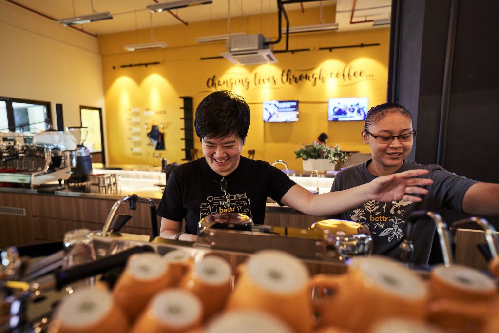 2 ladies making coffee from a coffee machine